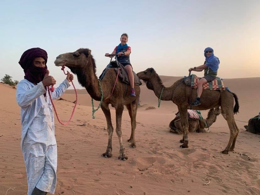 Camel riding with guide