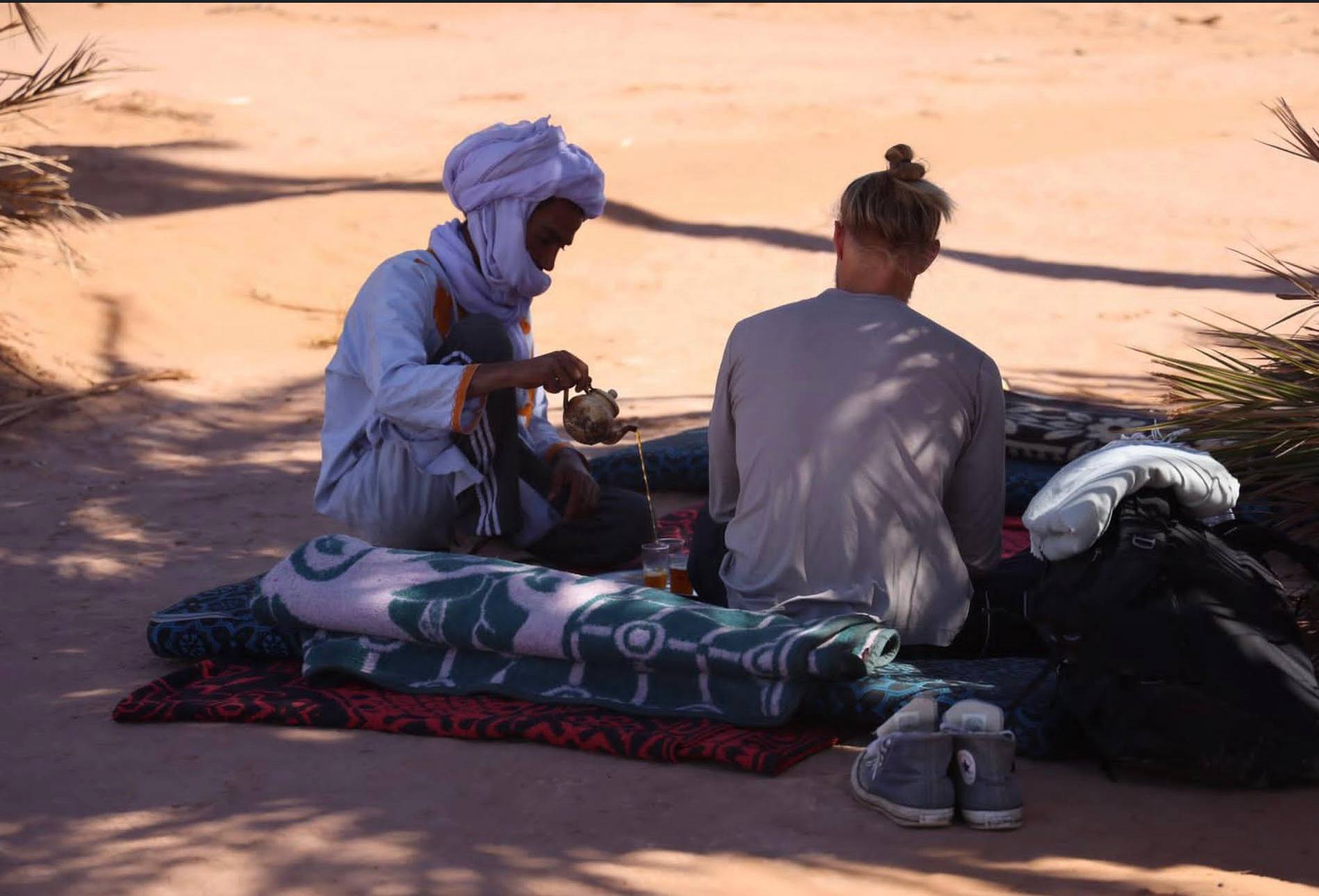 Ibrahim pouring traditional tea in the Sahara